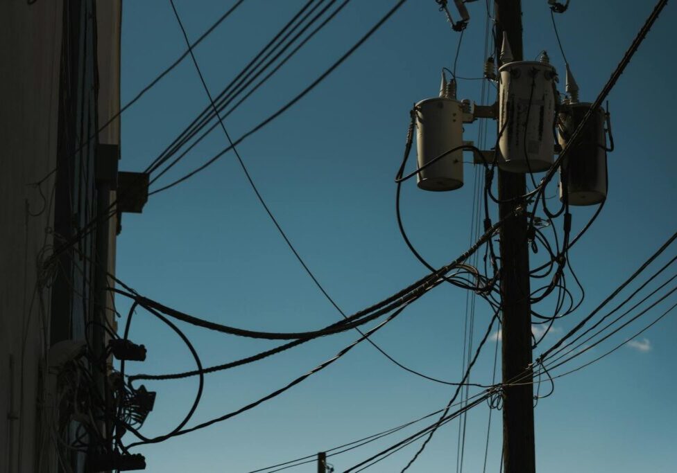 Utility pole with transformer delivering residential electrical service in a Pittsburgh neighborhood